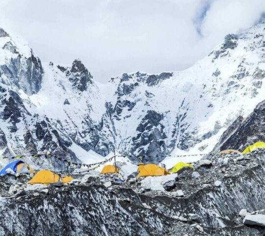 Everest base camp in Nepal with yellow tents.