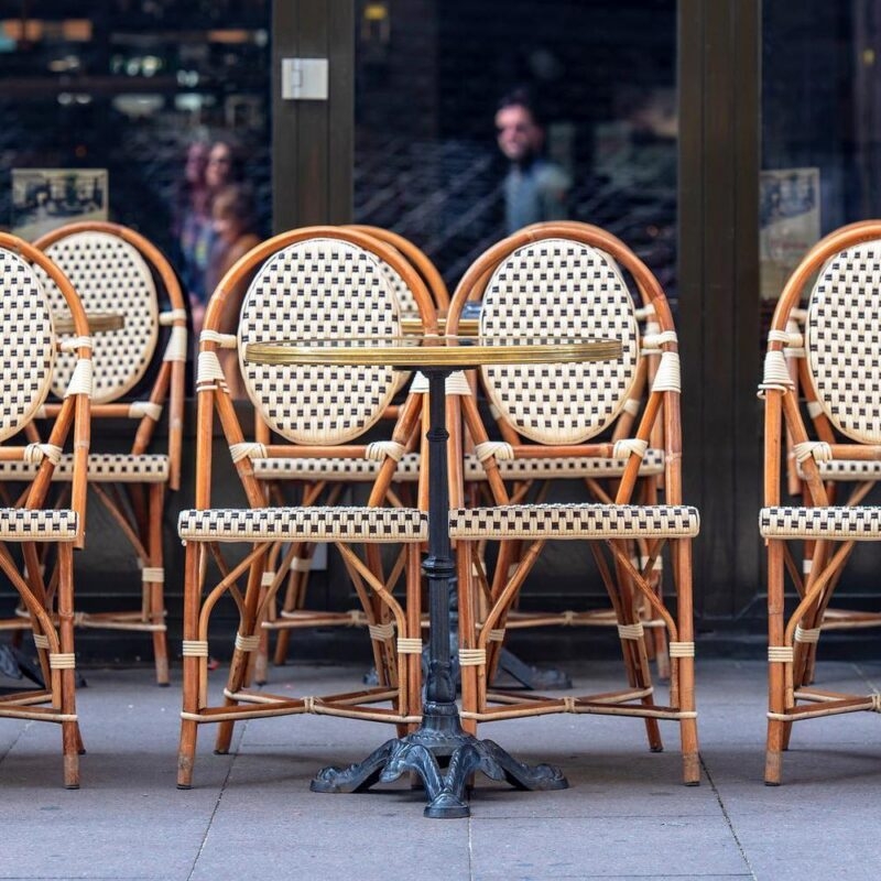 Chairs lined up on the pavement outside a cafe in Paris