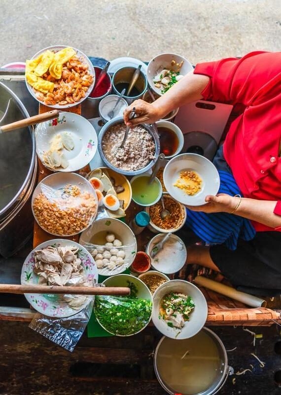 Aerial view of a woman preparing traditional Vietnamese food
