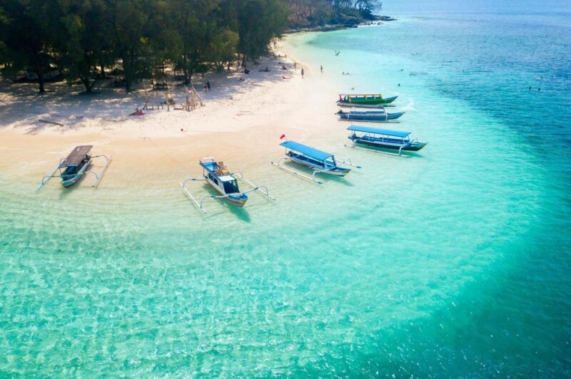 Aerial view of small boats on a beach in Bali