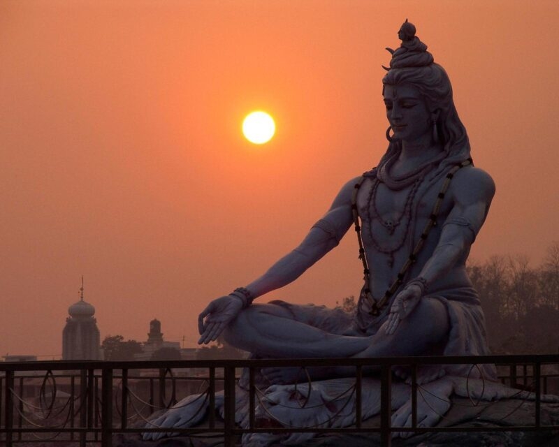 A statue of Shiva at sunrise