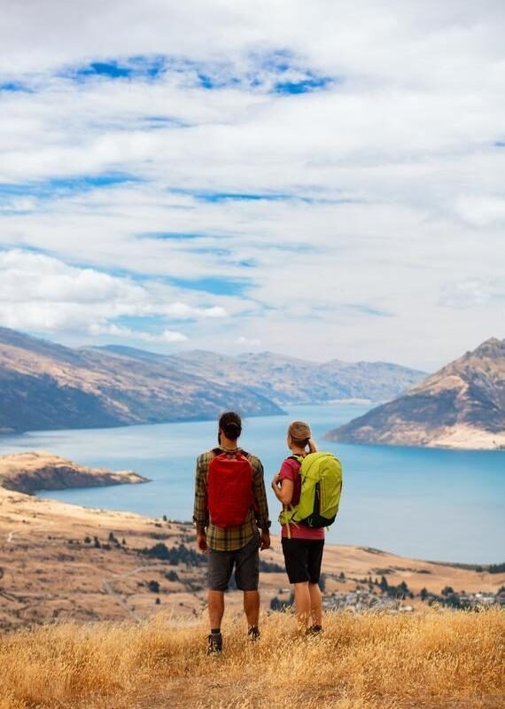 Young hikers viewing Landscape Lake Wakatipu New Zealand