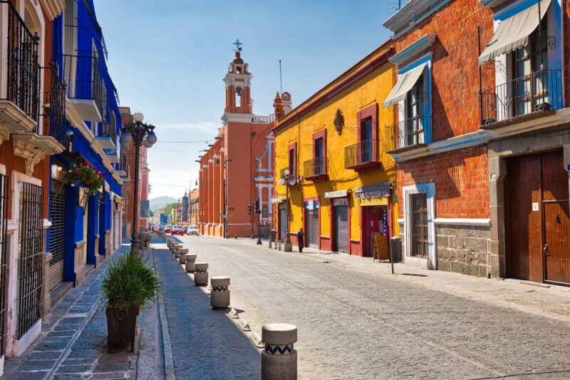 Street lined with colourful houses in Puebla, Mexico