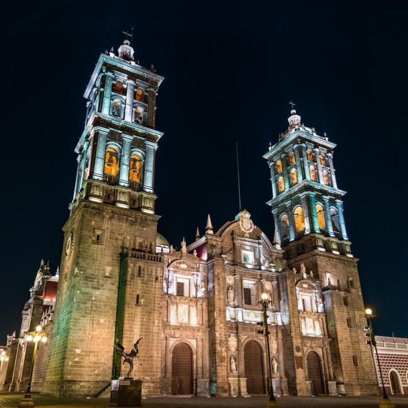 Puebla Cathedral lit up at night in Puebla, Mexico