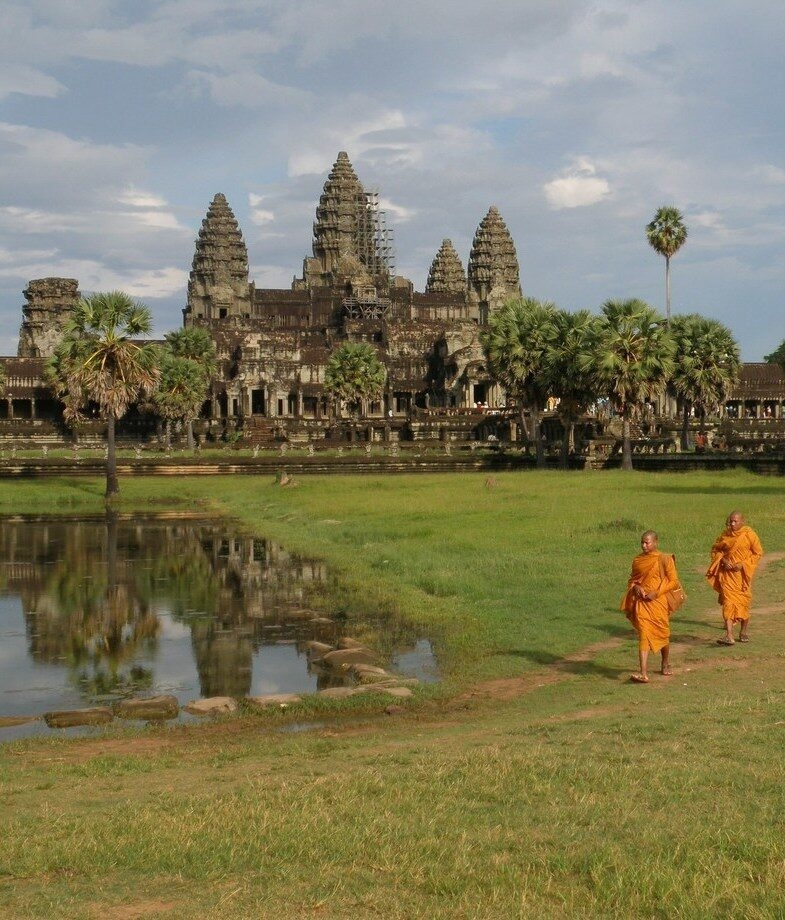 Saffron-robed monks in the sacred temples of Angkor Wat in Cambodia and the lush green rice terraces of Bali, Indonesia.