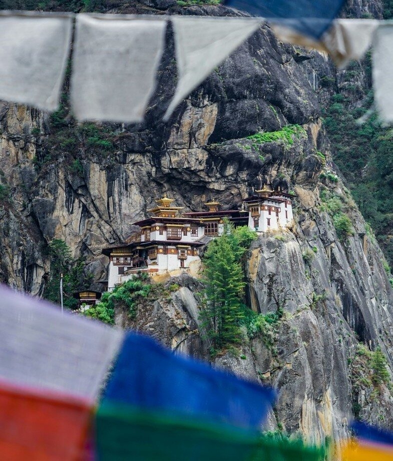 The beautiful architecture of Chiang Mai in Thailand and the renowned cliffside monastery of Paro Taktsang in Bhutan.