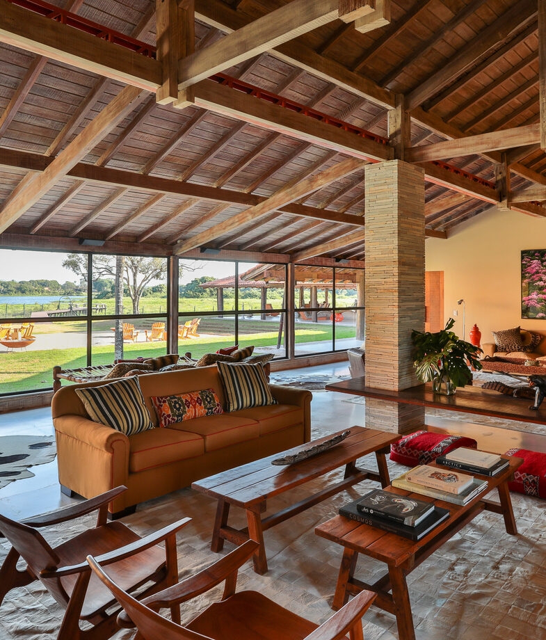 The clear waters of the private beach at Ponta Dos Ganchos and the rustic main lodge at Casa Caiman.