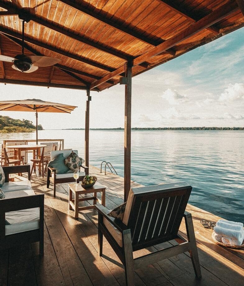 The riverside sundeck at Anavilhanas Jungle Lodge and the floating deck at Cristalino Jungle Lodge.