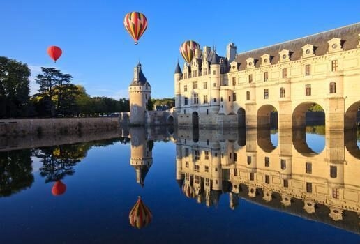 The snow-capped peaks and calm waters of Lake Wakatipu in Queenstown, drifting past the Château de Chenonceau in the Loire Valley and soaring over the winding rivers and savannahs of the Maasai Mara.