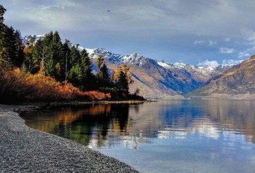 The snow-capped peaks and calm waters of Lake Wakatipu in Queenstown, drifting past the Château de Chenonceau in the Loire Valley and soaring over the winding rivers and savannahs of the Maasai Mara.