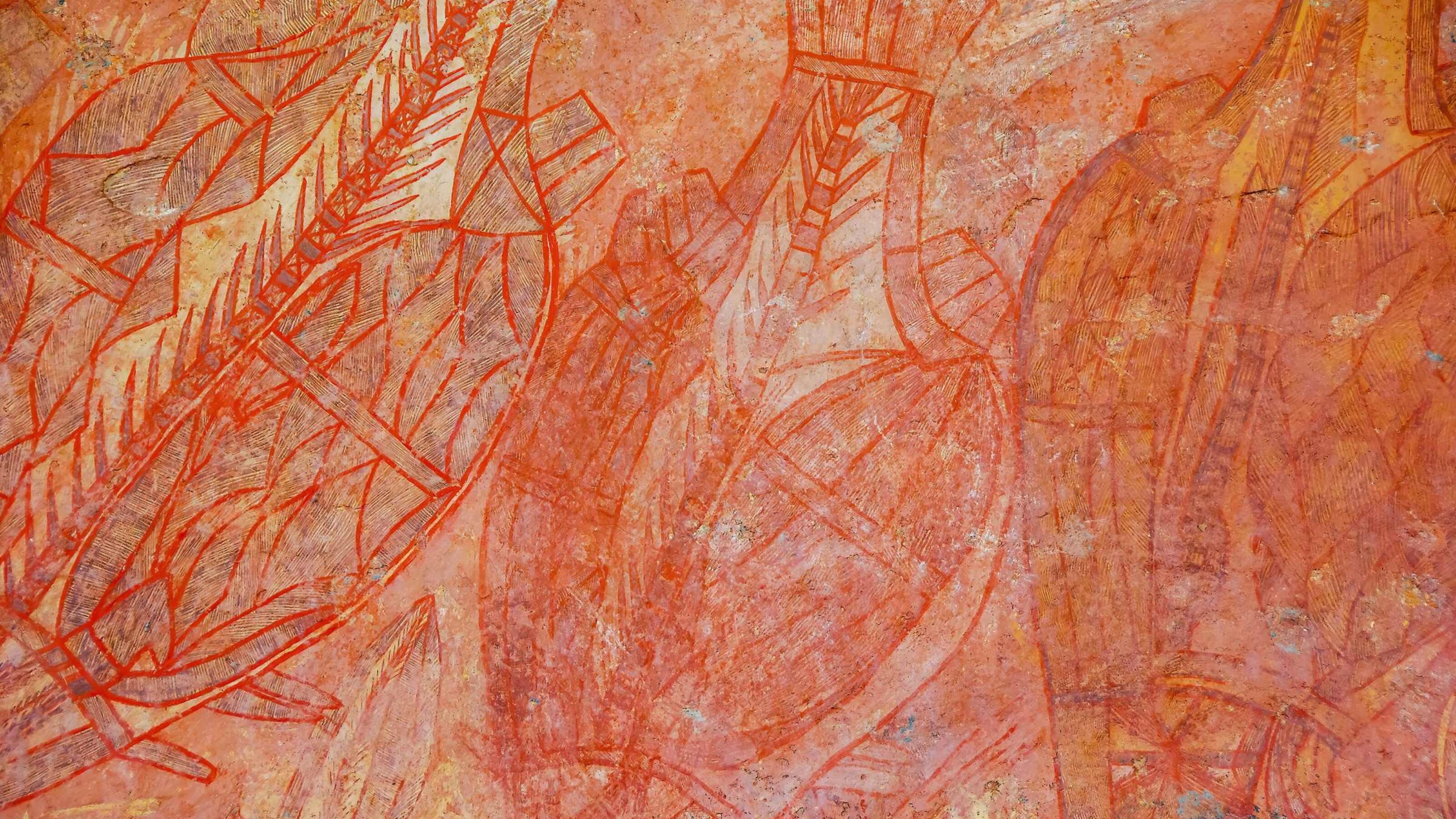 Close up view of 30,000 year old Aboriginal rock paintings of fish catch at Ubirr rock art site in Kakadu National Park