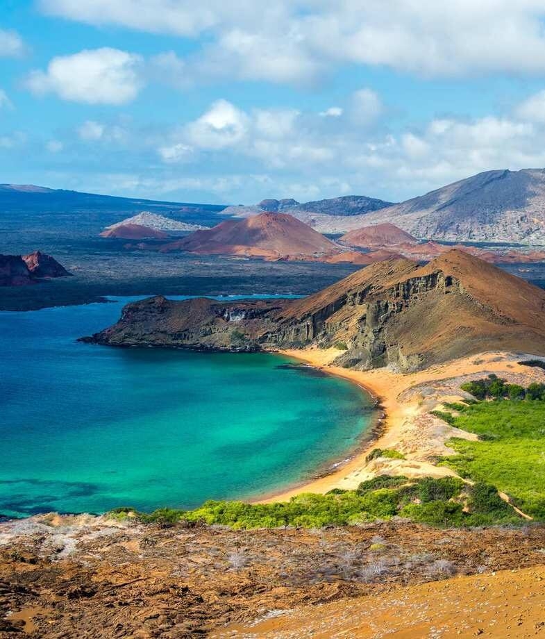 Climb to the summit of Bartolomé Island for sweeping views of Pinnacle Rock and meet the giant tortoises roaming freely in the lush highlands of the Galápagos.