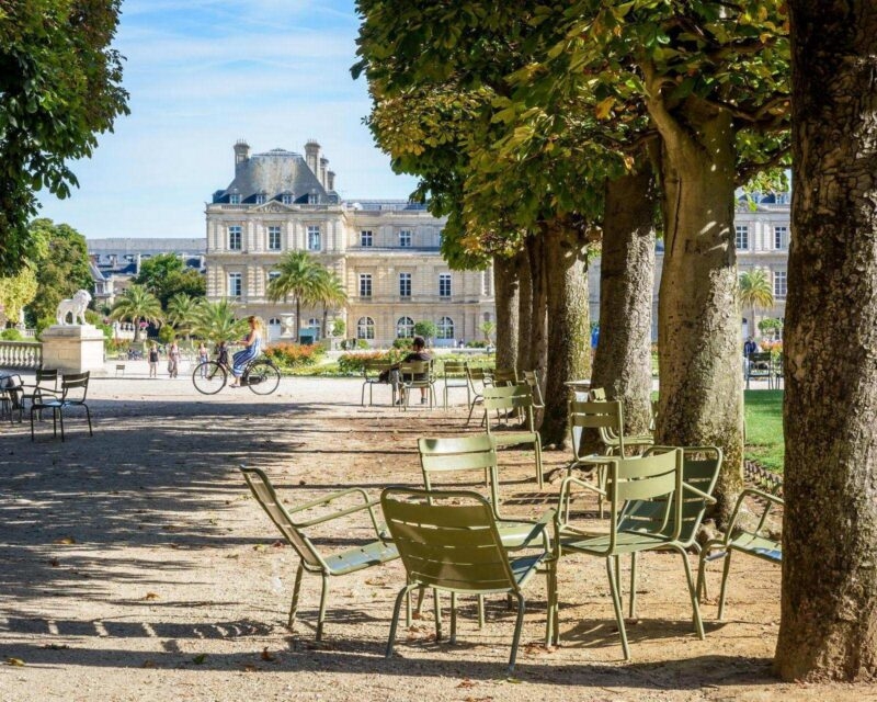 Metal chairs on a pathway in the Jardin du Luxembourg in Paris