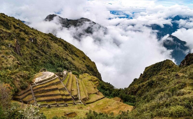 View of Incan ruins in Peru shrouded in mist