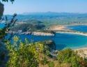 View of beach surrounded by water at Costa Navarino in Greece