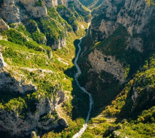 Looking down into the river at the bottom of Vikos Gorge in Greece