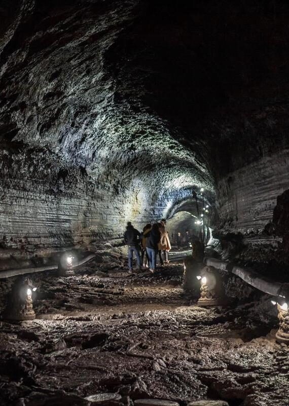 The corridor inside the Manjanggul cave with lights to watch the flow of lava flows. At Jeju Island, South Korea.