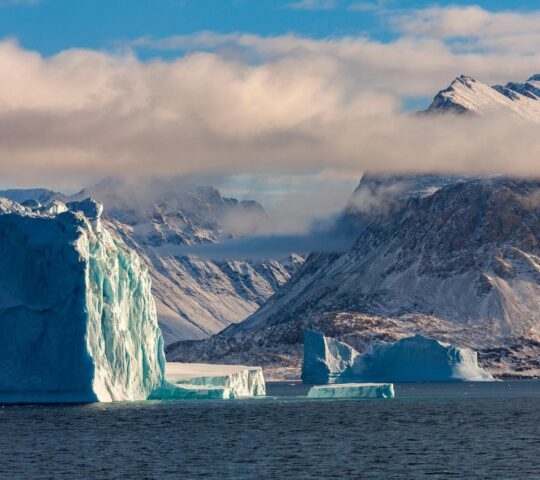 A view of Scoresbysund fjord's colossal icebergs in Greenland.