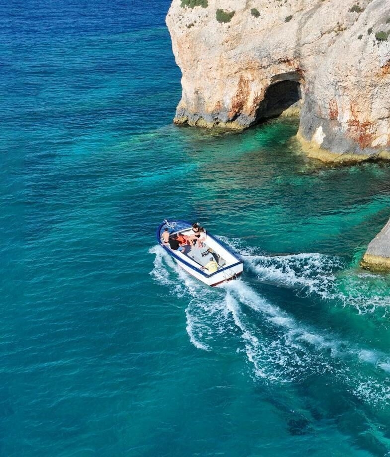 The floor of Samaria Gorge National Park in Crete, and a private boat across the turquoise waters near Corfu’s Blue Caves.