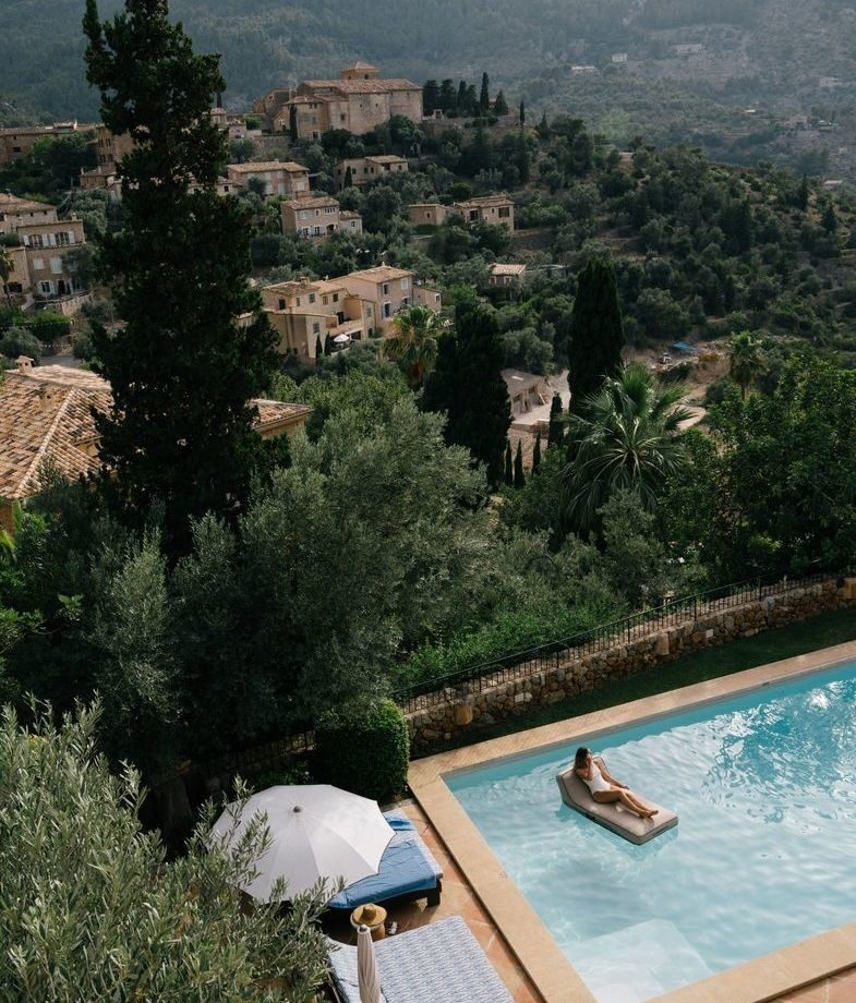 A relaxing day by the swimming pool at Belmond La Residencia, and Hotel Arts Barcelona rising above the Mediterranean beachfront at sunset.