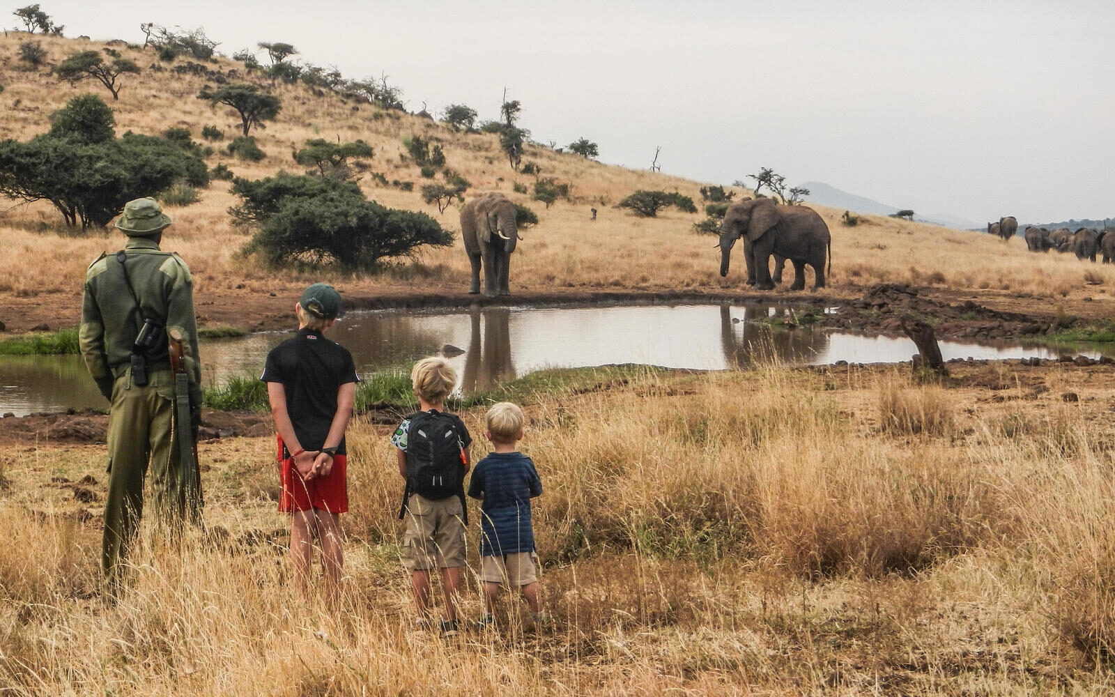 Watching elephants at the water’s edge at Lewa House in Kenya. One of those family safari moments you and your family do not forget.