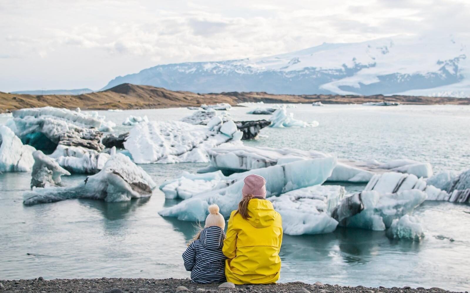 A quiet mother-daughter moment by Iceland’s glacial lagoon on the Atlantic coast.
