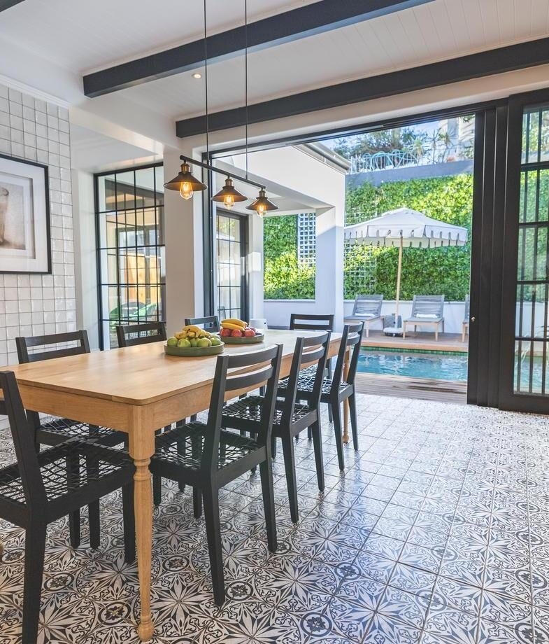 The sunlit terrace with mountain views over Cape Town at Mount Nelson Hotel, and the bright family villa dining room opening onto a small pool terrace at Cape Cadogan Residence.