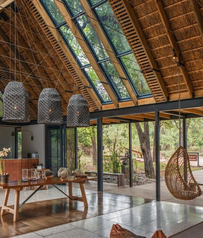 The light-filled lounge opening onto the bush at Lion Sands River Lodge, and one of the river-facing plunge pool decks at Chitwa Chitwa.