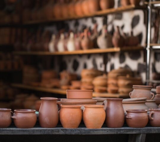 A row of clay pots lined up on display in a pottery workshop in Baku, Azerbaijan
