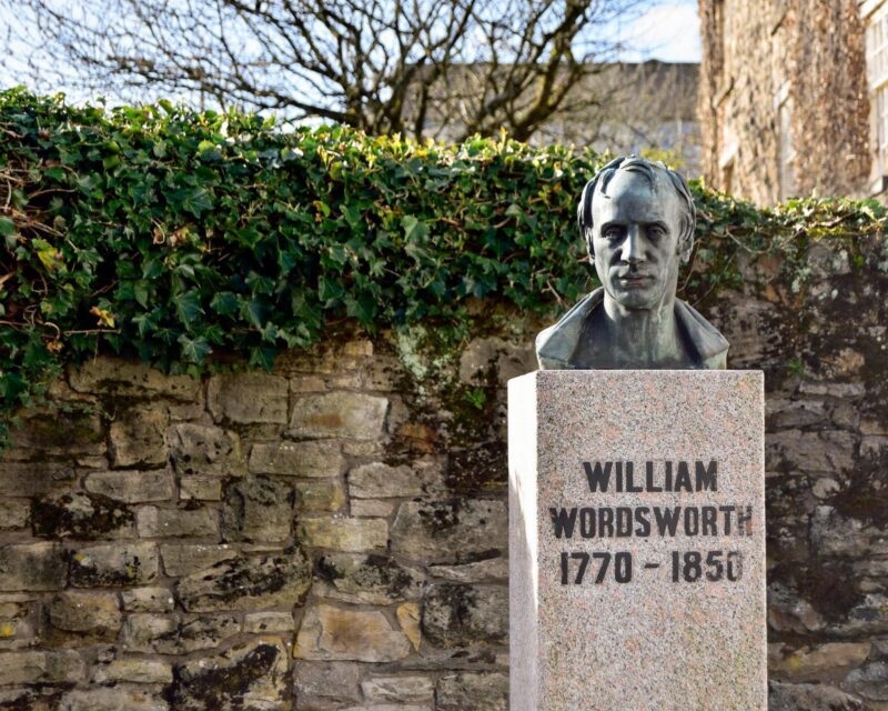 Bronze bust of William Wordsworth on a stone pedestal inscribed with his name and dates 1770-1850.