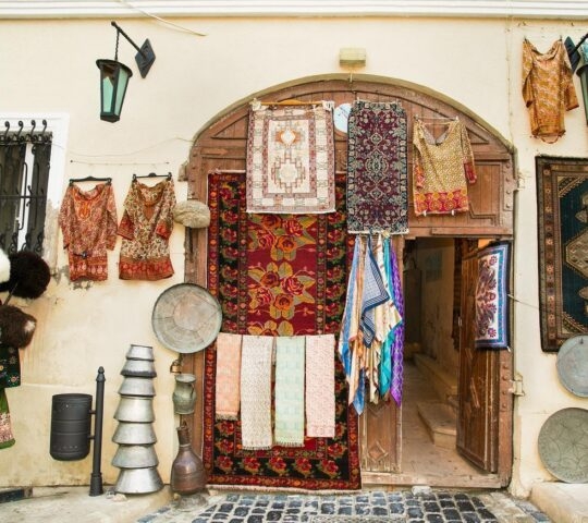 traditional storefront showcasing souvenirs such as carpets in Baku, Azerbaijan