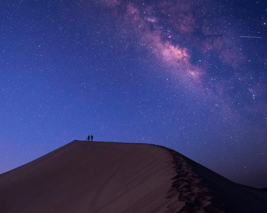 A starry sky over sand dunes in the Moroccan Sahara