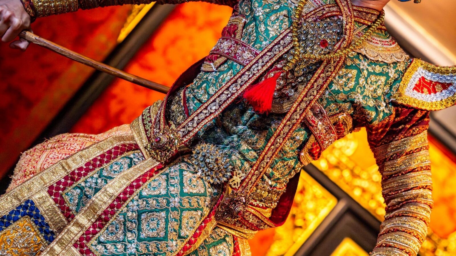 A traditional Thai dancer in traditional performance clothing.