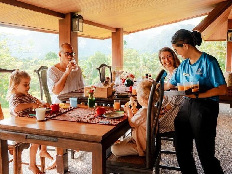 A family enjoy a private breakfast in Thailand.
