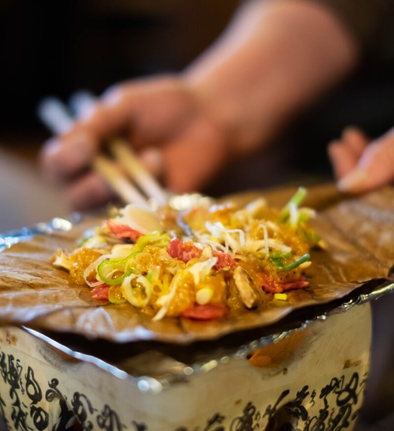 Charcoal grilled hida beef on oba leaf with miso and vegetables, traditional food at Takayama, Japan